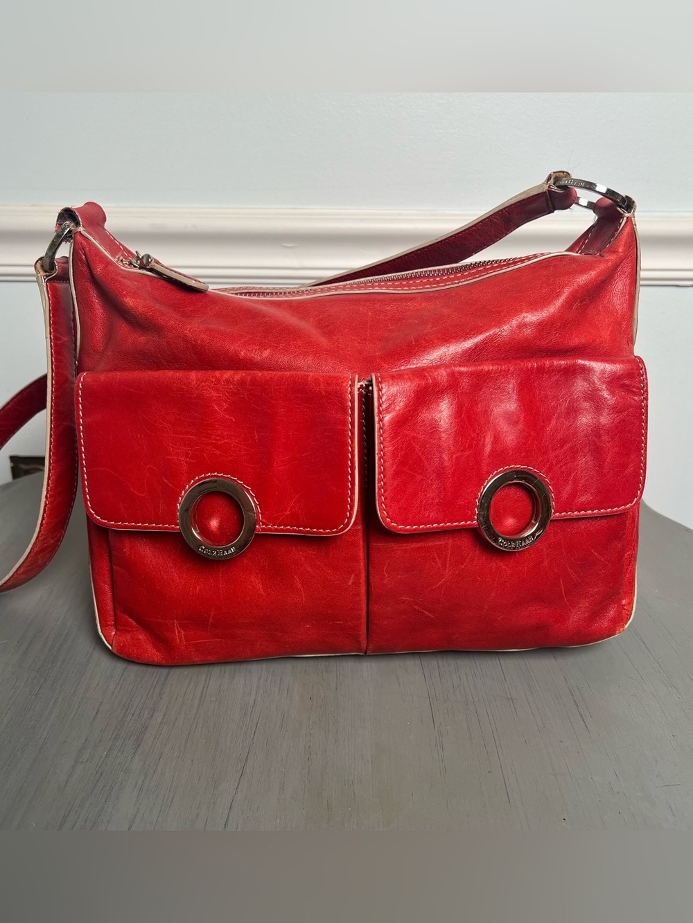 Cole Haan Red Leather shoulder Bag with Front Pockets/silver tone grommets. ❤️